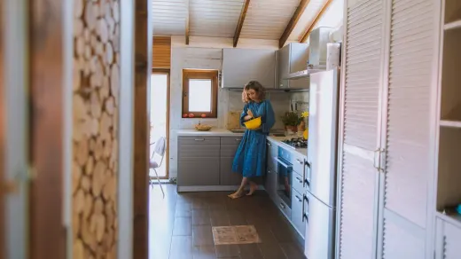 Dog owner preparing dog food kitchen