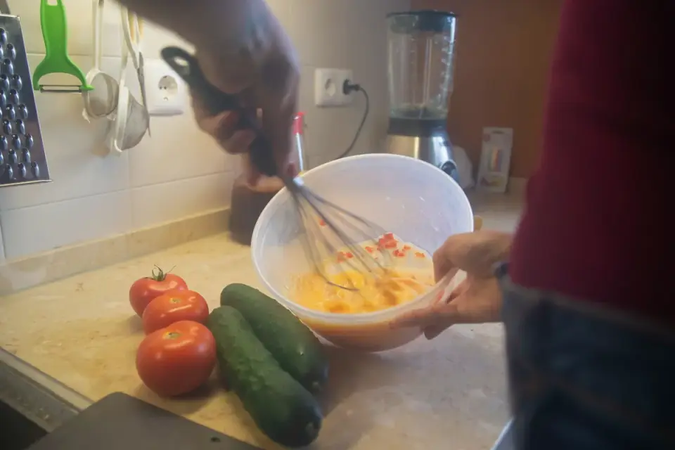 Dog owner preparing dog food kitchen
